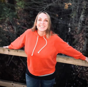 Kelly smiling outdoors
